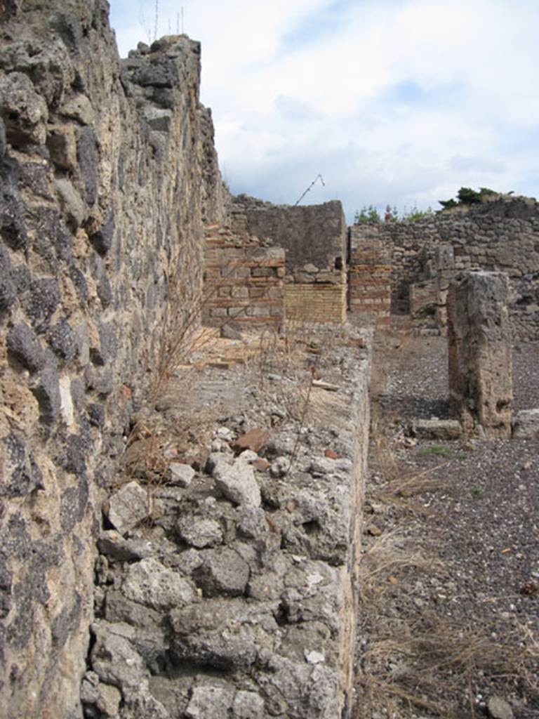 I.3.10 Pompeii. September 2010. Looking east along line of the Sarno canal wall. On the left, the north wall of the entrance room can be seen. Photo courtesy of Drew Baker.