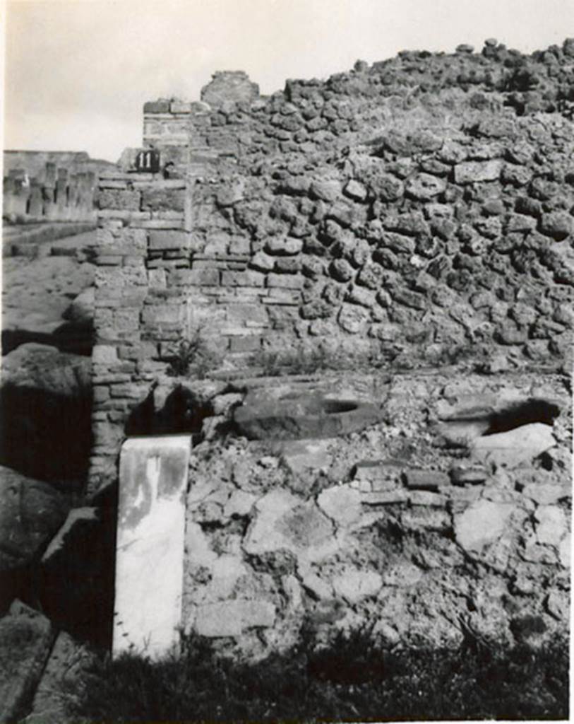 I.3.11 Pompeii. 1935 photograph taken by Tatiana Warscher. Looking north from entrance towards the podium. 
See Warscher, T, 1935: Codex Topographicus Pompejanus, Regio I, 3: (no.27), Rome, DAIR, whose copyright it remains.