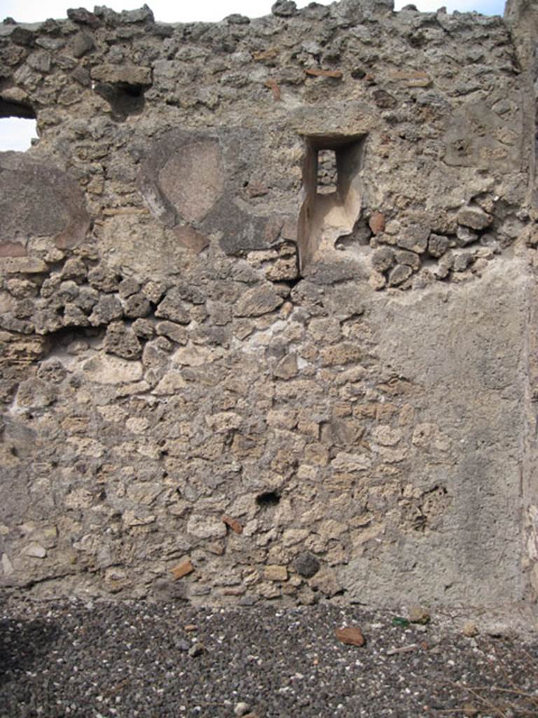 I.3.12 Pompeii. September 2010. North wall in rear room in north-east corner with slit window onto Vicolo del Menandro. Photo courtesy of Drew Baker. According to CTP, when the survey was written  “the north wall of the back room has now vanished”.
See Van der Poel, H. B., 1986. Corpus Topographicum Pompeianum, Part IIIA. Austin: University of Texas. (p.6)