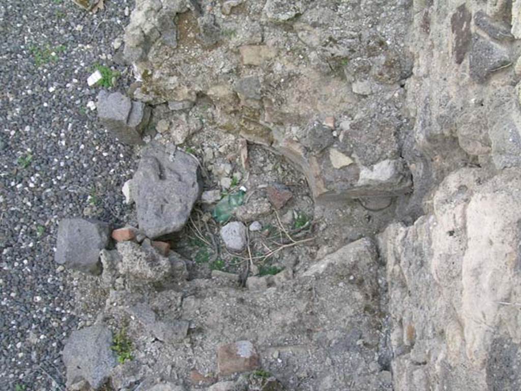 I.3.15 Pompeii. June 2005. Looking down on area in hearth for heating boiler, near west wall. Photo courtesy of Nicolas Monteix.