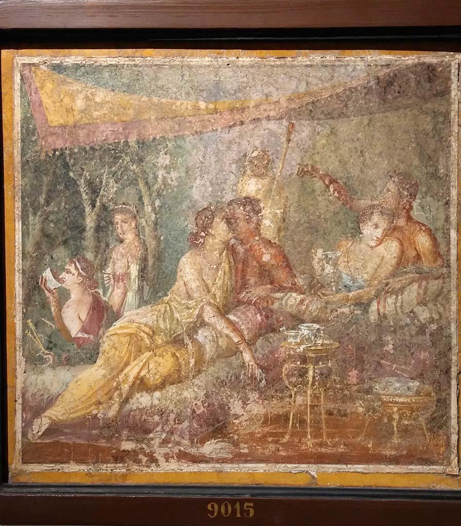 I.3.18 Pompeii. Wall painting of a banquet scene with couple kissing.
Now in Naples Archaeological Museum. Inventory number 9015.
According to Richardson, the above painting was found with another banquet scene, inventory number 9016.
See Richardson, L., 2000. A Catalog of Identifiable Figure Painters of Ancient Pompeii, Herculaneum. Baltimore: John Hopkins, (p.120)