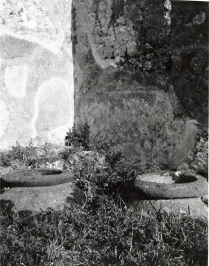 I.3.20 Pompeii. 1935 photograph taken by Tatiana Warscher. Two of the dolia embedded in the garden area.
See Warscher, T, 1935: Codex Topographicus Pompejanus, Regio I, 3: (no.37), Rome, DAIR, whose copyright it remains.