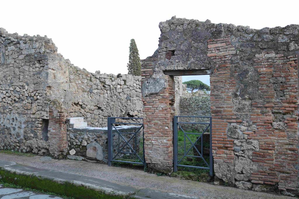 I.3.22 Pompeii. December 2018. 
Looking towards entrance doorway of thermopolium on Vicolo del Menandro. On the right is the doorway to I.3.21.
Photo courtesy of Aude Durand.
