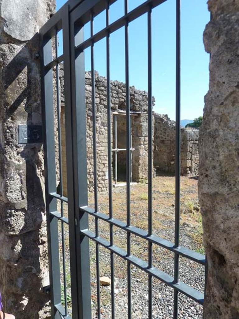 I.3.23 Pompeii. September 2015. Looking towards east side of entrance doorway with number-plate.