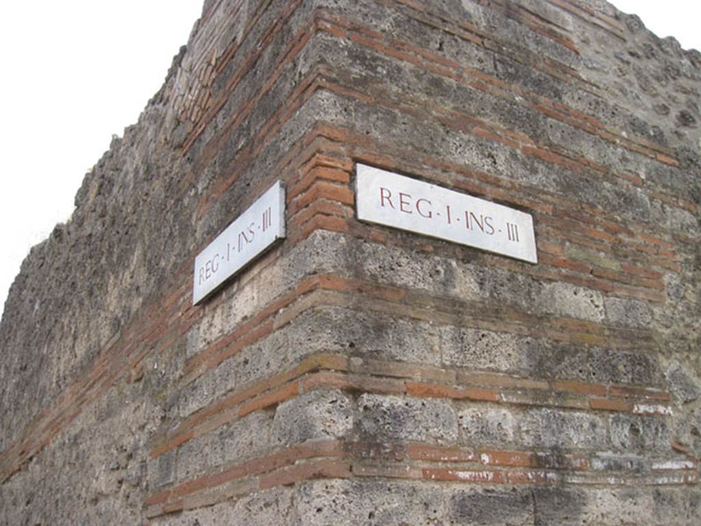 I.3.24 Pompeii. September 2010. Exterior wall on corner of Vicolo del Menandro (image right) and vicolo del Citarista (image left).  Photo courtesy of Drew Baker.