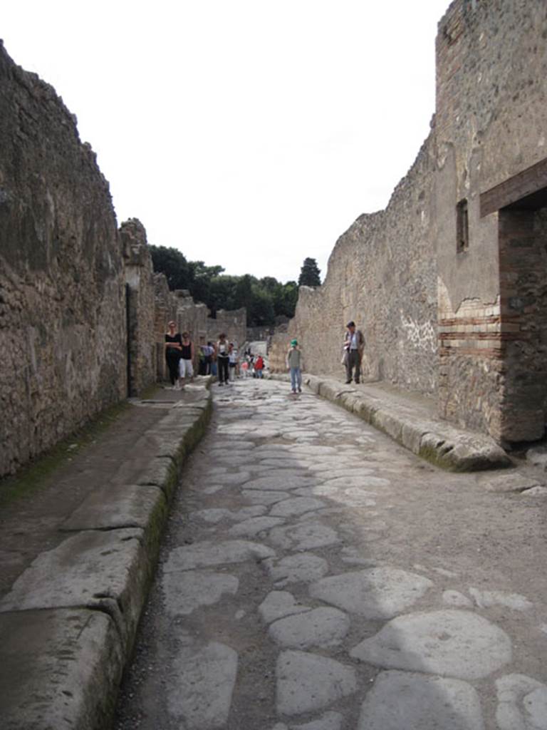 I.3.24 Pompeii. September 2010. Looking west along Vicolo del Menandro between I.3 and I.4, from outside entrance doorway.  Photo courtesy of Drew Baker.