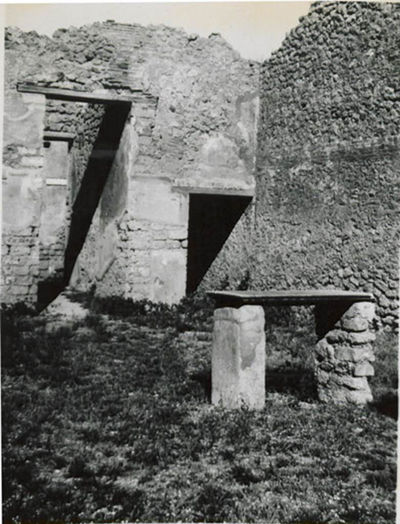 I.3.24 Pompeii. 1935 photograph taken by Tatiana Warscher. Looking towards the table in the atrium.  According to Warscher, the table was marble leaning on two masonry supports.
See Warscher, T, 1935: Codex Topographicus Pompejanus, Regio I, 3: (no.52), Rome, DAIR, whose copyright it remains.