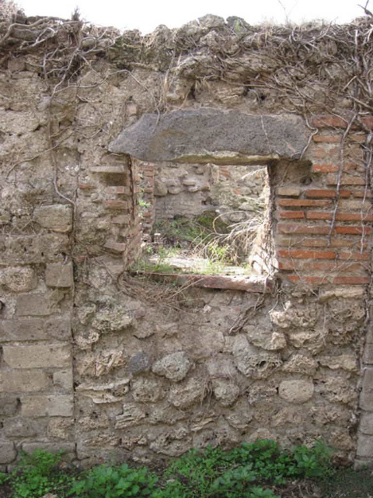 I.3.27 Pompeii. September 2010. Looking towards aperture into oven in west wall of room. 
Photo courtesy of Drew Baker.