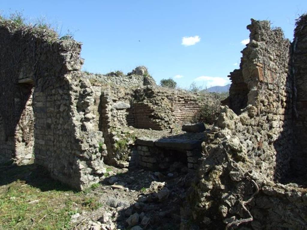 I.3.27 Pompeii. March 2009. Looking south-east towards remains of oven on south side of bakery room.