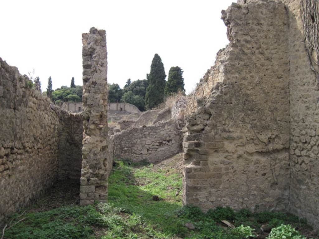 I.3.27 Pompeii. September 2010. Looking towards two doorways at western end of bakery room.  Photo courtesy of Drew Baker.