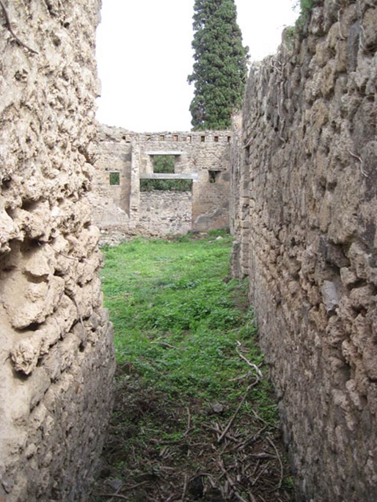 I.3.27 Pompeii. September 2010. Looking east from narrow passageway towards bakery room. Photo courtesy of Drew Baker.