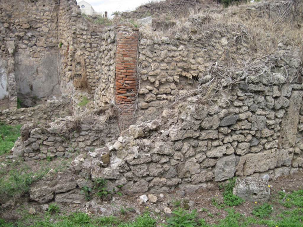 I.3.29 Pompeii. September 2010. Room 5, north wall, the western part is no longer standing. Looking north towards part of I.3.30. Photo courtesy of Drew Baker.