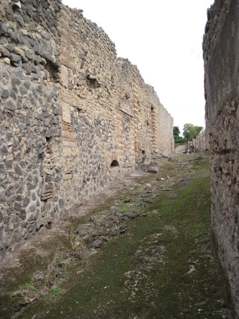 I.3.30 Pompeii. September 2010. Looking east along unnamed vicolo towards doorway of I.3.30. Photo courtesy of Drew Baker.