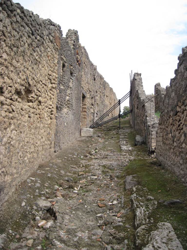 I.3.31 Pompeii. September 2010. Looking east from west end of unnamed vicolo towards entrance doorway, on left. Photo courtesy of Drew Baker.