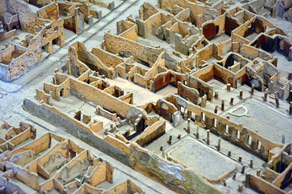 I.4.2 Pompeii, centre left. October 2019. Looking north-west.
On left is Via Stabiana, at junction with Vicolo del Menandro, I.4.2 is on the left, on the north side of the roadway. 
Foto Tobias Busen, ERC Grant 681269 DÉCOR.