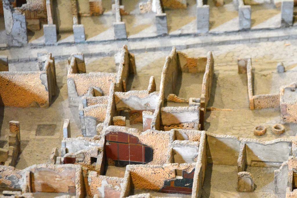 I.4.9 Pompeii. May 2019. Detail from model in Naples Archaeological Museum.
Triclinium/oecus m, according to the model, the west wall of the triclinium, painted black/red, is shown in the lower centre.
Foto Tobias Busen, ERC Grant 681269 DÉCOR.