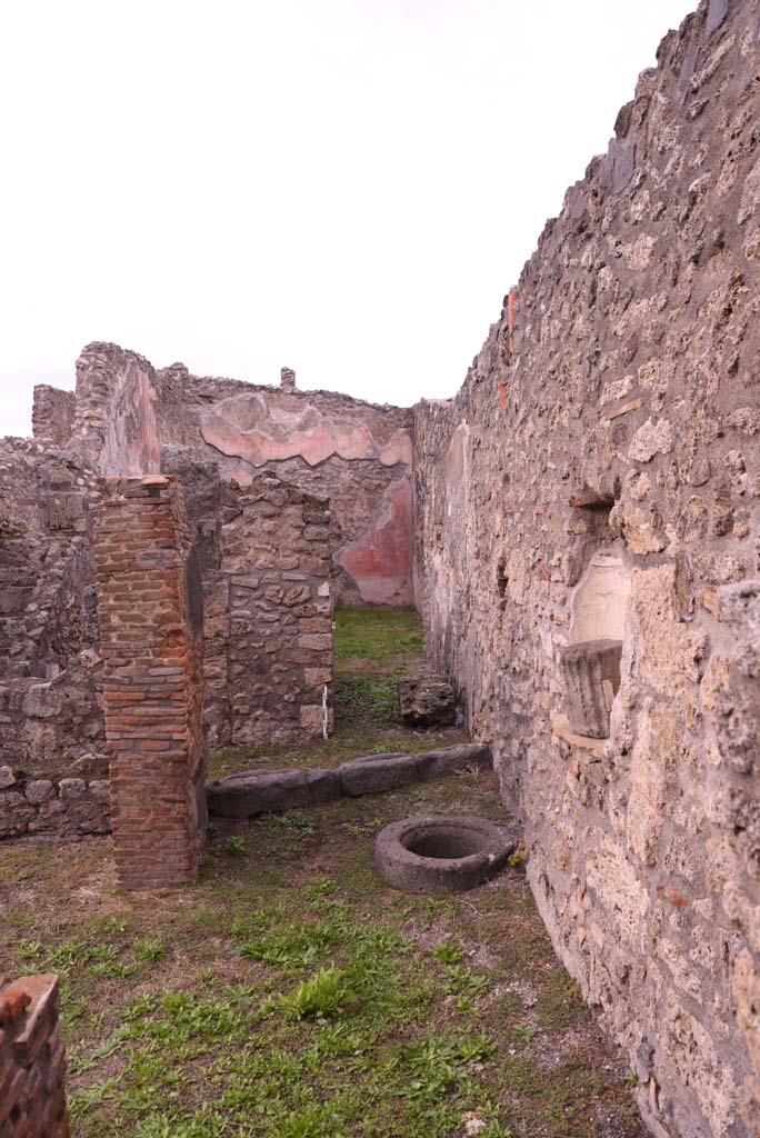 I.4.9 Pompeii. October 2019. 
Courtyard n, looking north towards cistern-mouth in floor, and niche in east wall.
Foto Tobias Busen, ERC Grant 681269 DÉCOR.