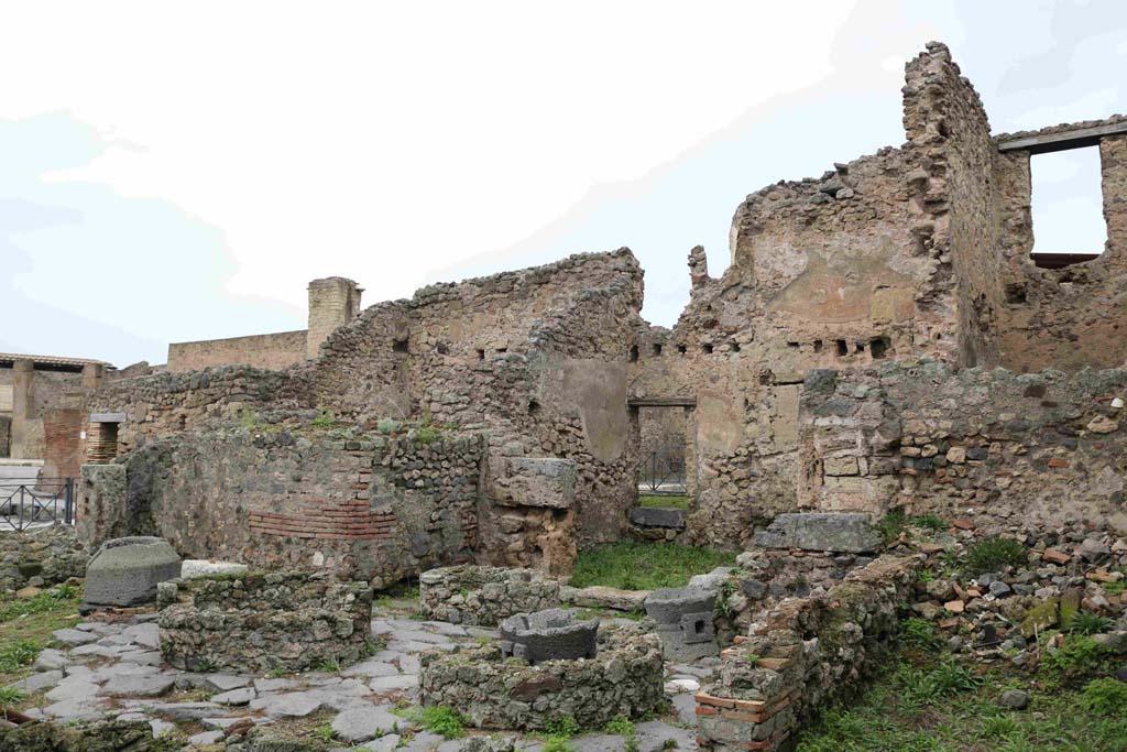 I.4.12 Pompeii. December 2018. Looking north-west across bakery rooms towards doorway at I.4.17 on Via dell’Abbondanza.
Photo courtesy of Aude Durand.