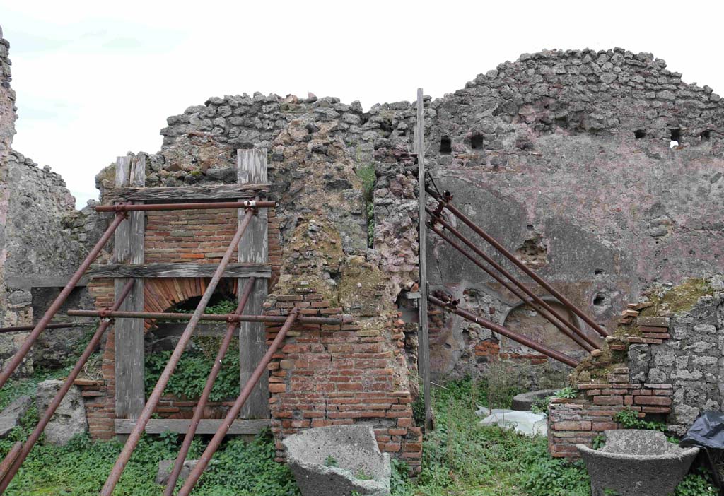I.4.12 Pompeii. December 2018. Looking south across bakery towards oven and doorway to room on west side.
Photo courtesy of Aude Durand.