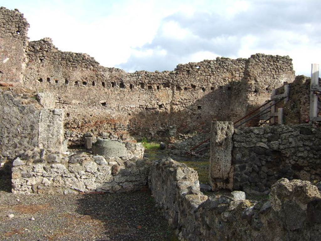 I.4.12 Pompeii. December 2005. Looking east towards bakery with millstones. Taken from I.4.13