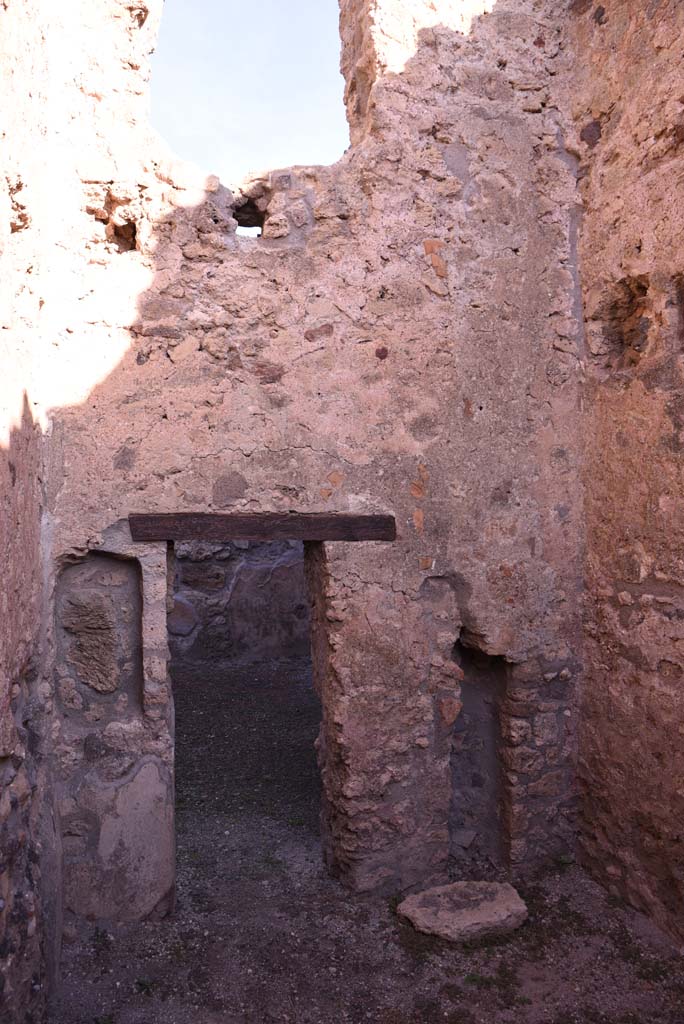I.4.18 Pompeii. October 2019. Looking towards north wall of rear room, with doorway into workshop.
Foto Tobias Busen, ERC Grant 681269 DÉCOR.