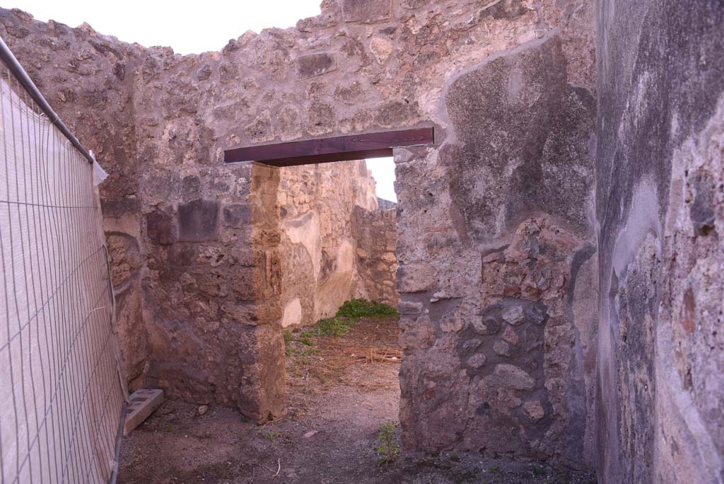I.4.19 Pompeii. October 2019. 
Looking towards south wall with doorway to rear room, on the left would have been the base of the stairs for an upper floor.
Foto Tobias Busen, ERC Grant 681269 DÉCOR.