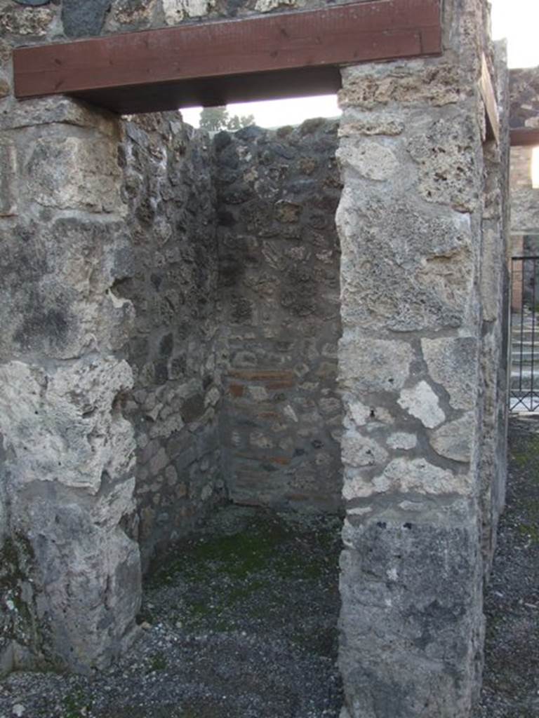 I.4.25 Pompeii. December 2007. 
Doorway to room 5, looking west into small room or ostiarius with two doorways.
Photograph is taken from the atrium, and the other door is in the south wall of the fauces/entrance corridor.