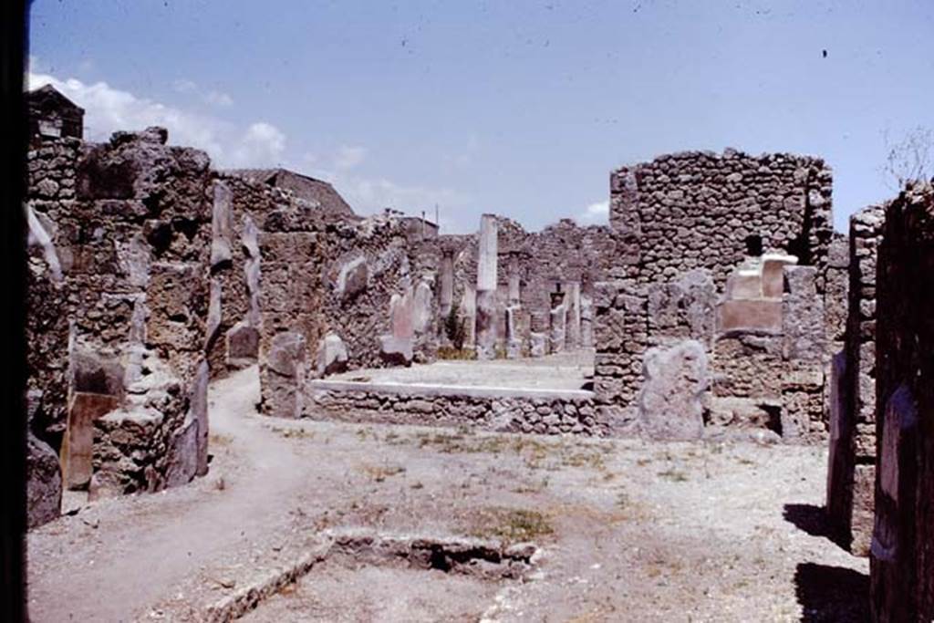 I.4.5/25 Pompeii. 1966. Looking east across atrium towards tablinum of 1.4.5 and the middle peristyle. Photo by Stanley A. Jashemski.
Source: The Wilhelmina and Stanley A. Jashemski archive in the University of Maryland Library, Special Collections (See collection page) and made available under the Creative Commons Attribution-Non Commercial License v.4. See Licence and use details.
J66f0569