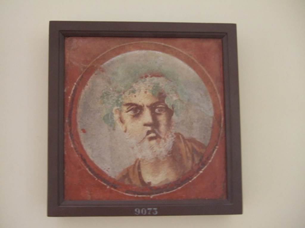 I.4.25 Pompeii. December 2007. Room 18, west wall. Painted medallion of an old man with grey beard. 
Now in Naples Archaeological Museum. Inventory number 9073.