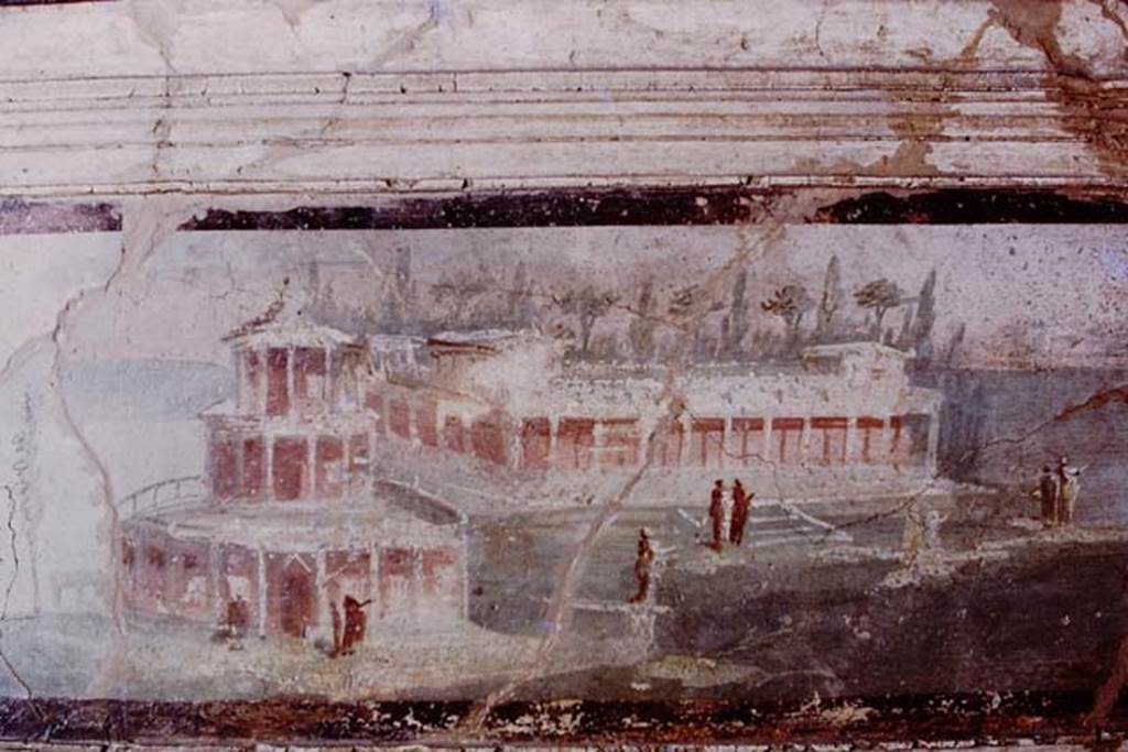I.4.25 Pompeii. 1975. 
Landscape painting of maritime villa from outside edge of epistyle, seen from garden of middle peristyle 17. Photo by Stanley A. Jashemski.   
Source: The Wilhelmina and Stanley A. Jashemski archive in the University of Maryland Library, Special Collections (See collection page) and made available under the Creative Commons Attribution-Non-Commercial License v.4. See Licence and use details.
J75f0556