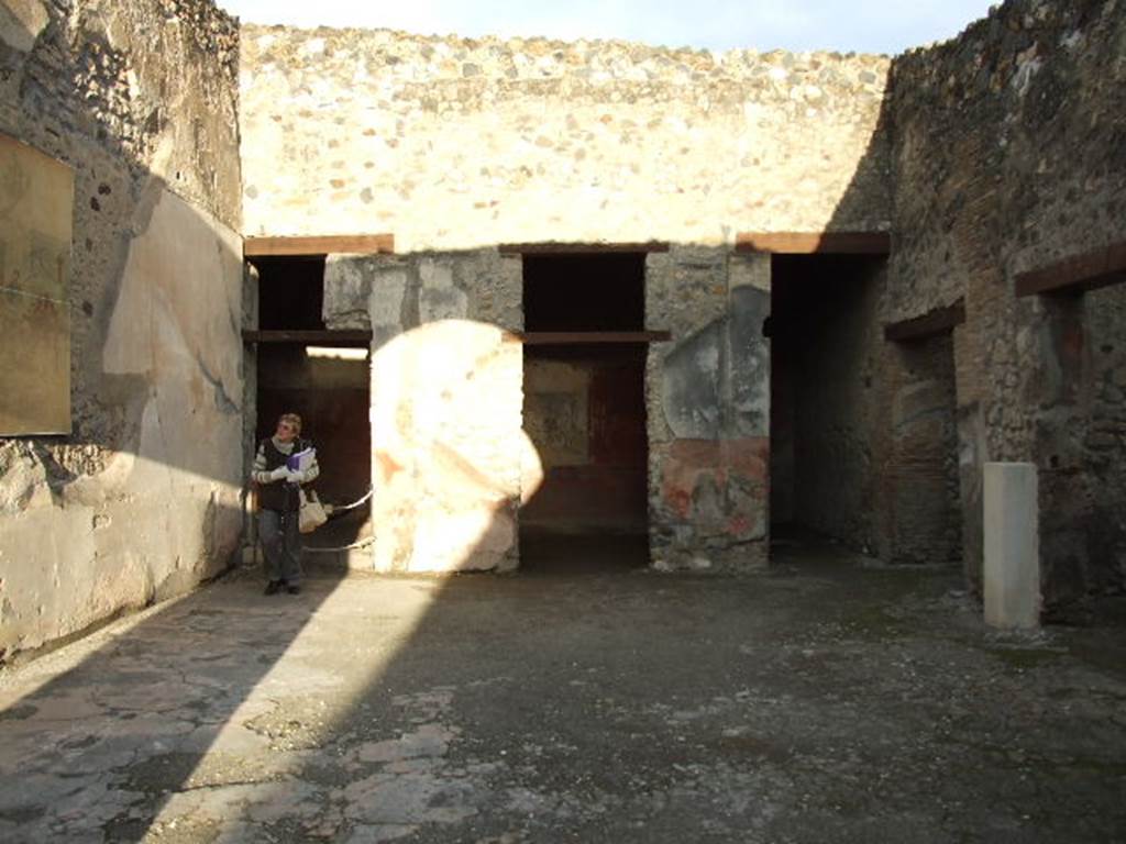 I.4.25 Pompeii. December 2006. Room 21, view across oecus of the Judgement of Paris.
There are doors to two cubiculum and a storeroom or apotheca at rear. Doors to a corridor and to a triclinium are to the right.