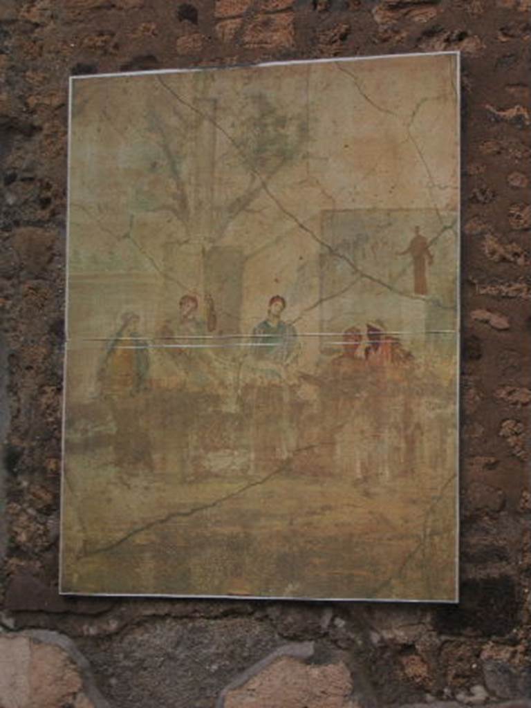 I.4.25 Pompeii. December 2004. 
Room 21, reproduction of painting of the Judgement of Paris on north wall of oecus.
Now in Naples Archaeological Museum. Inventory number 120033.
Paris is listening to Mercury in the presence of the three goddesses. 
Minerva and Venus are standing with Juno in the middle sitting on her throne.