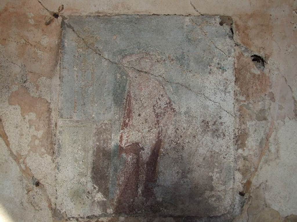 I.4.25 Pompeii. December 2006. 
Room 23, east wall of cubiculum. Remains of a wall painting of Apollo with a plectrum in his right hand above his head. 
The lyre is in his other hand. A base nearby has a tripod on it. 
See Helbig, W., 1868. Wandgemälde der vom Vesuv verschütteten Städte Campaniens. Leipzig: Breitkopf und Härtel. (183, p.51).