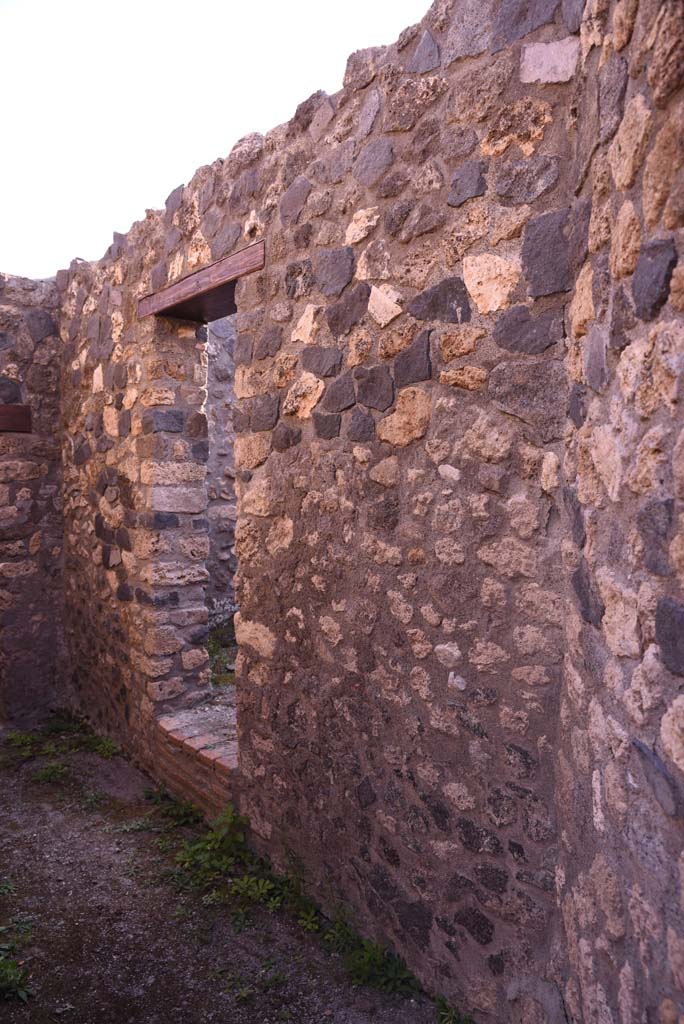 I.4.25/I.4.5 Pompeii. October 2019. 
West wall of Corridor 13A, or unnumbered corridor, with doorway into Tepidarium 40.
Foto Tobias Busen, ERC Grant 681269 DÉCOR.