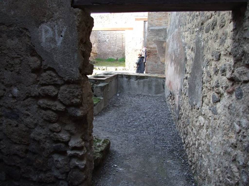 I.4.27 Pompeii. December 2007.  Looking north from rear room to counter and entrance.
