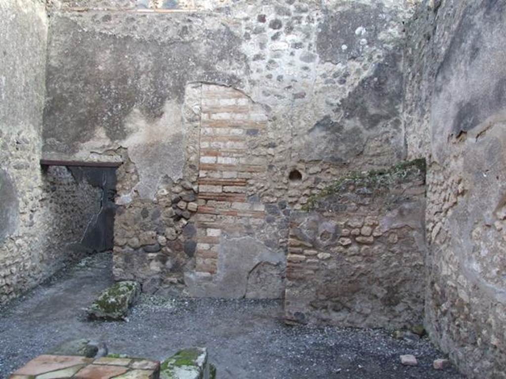 I.4.27 Pompeii. December 2007. South wall with latrine behind small wall.