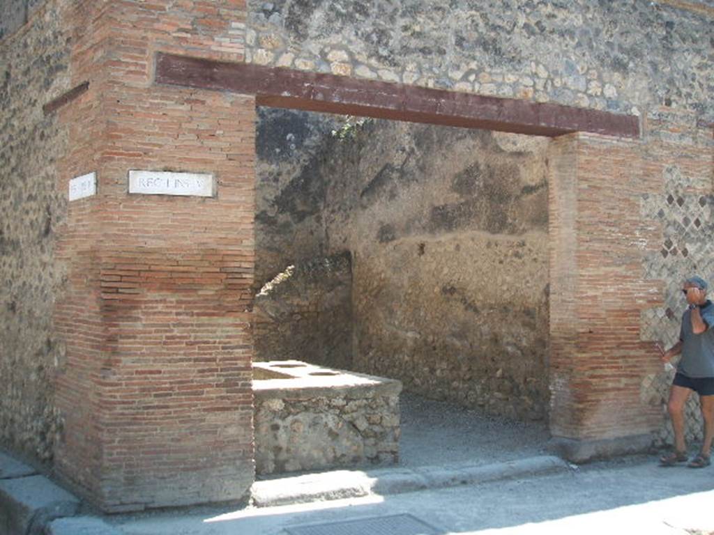 I.4.27 Pompeii. May 2005. Entrance on Via dell’Abbondanza.
Somewhere in this tavern Sogliano described a painting of gladiators:
“Coppia di gladiatori combattenti l’un contro l’altro; sono armati di elmo cristato, di grand escudo rettangolare, di gambali e di gladio impugnato”
See Sogliano, A., 1879. Le pitture murali campane scoverte negli anni 1867-79. Napoli. (p.138, no 667)
Jacobelli says no trace of this fresco remains visible today.  
She described “Pair of gladiators in combat: they are armed with crested helmets, large, rectangular shields, leggings and swords.”  
See Jacobelli, L., 2003. Gladiators at Pompeii. Rome: L’Erma di Bretschneider. (p.73).