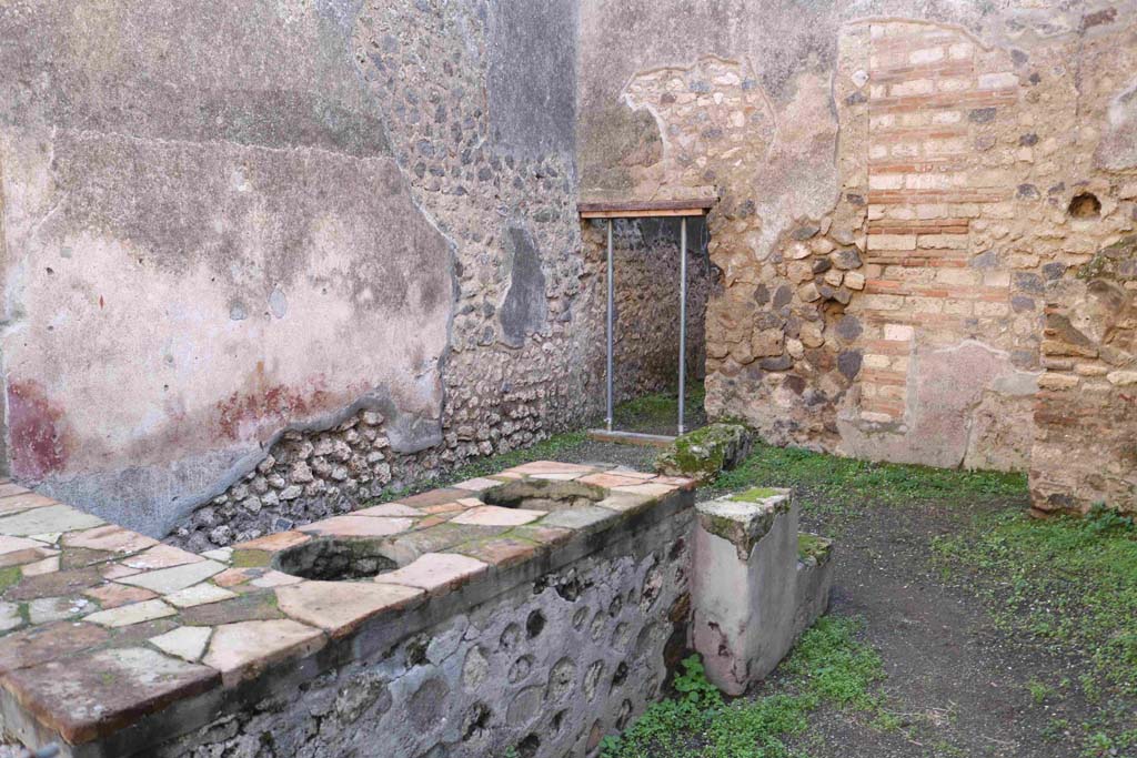 I.4.27 Pompeii. December 2018. Looking south-east across counter towards doorway to rear room. Photo courtesy of Aude Durand.