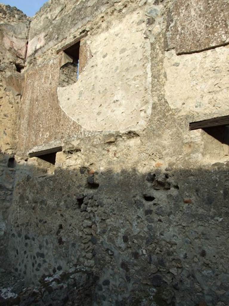 I.4.28 Pompeii. December 2007. 
Room 27, stables with drinking trough. Upper east wall with windows on two floors.