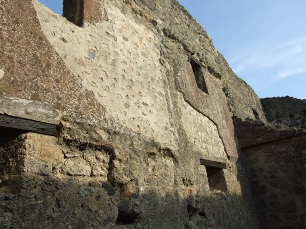 I.4.28 Pompeii. December 2007. Room 27, stables with drinking trough. Looking south along east wall with windows on two floors.