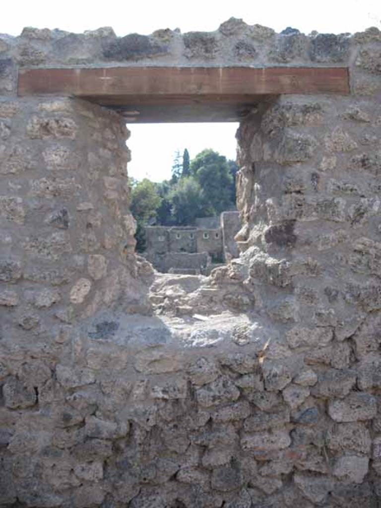 I.5.1 Pompeii. September 2010. Looking west from window in rear room, looking onto unnamed vicolo and west towards Via Stabiana. Photo courtesy of Drew Baker.