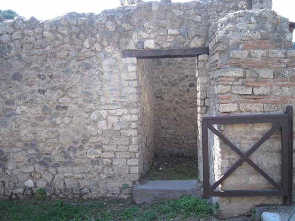 I.5.2 Pompeii. September 2010. Doorway to room on west side of shop-room. Photo courtesy of Drew Baker.