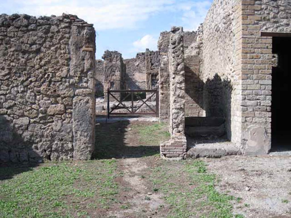 I.5.2 Pompeii. September 2010. Looking north across antechamber, across shop-room to entrance doorway. Photo courtesy of Drew Baker.