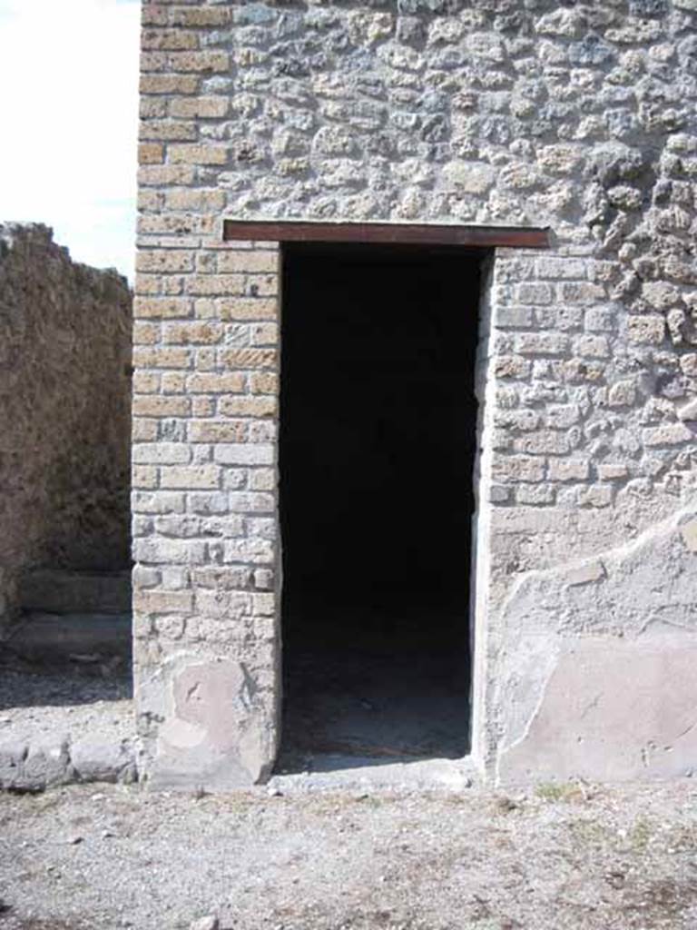I.5.2 Pompeii. September 2010. Doorway to small room, possibly an oecus, on east side of stairway. Looking north. Photo courtesy of Drew Baker.