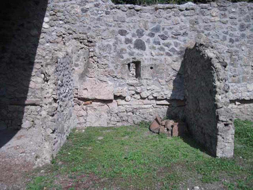 I.5.2 Pompeii. September 2010.  Looking east towards left-hand bay, one of six divided compartments.  Note the pipe work in wall.  Photo courtesy of Drew Baker.