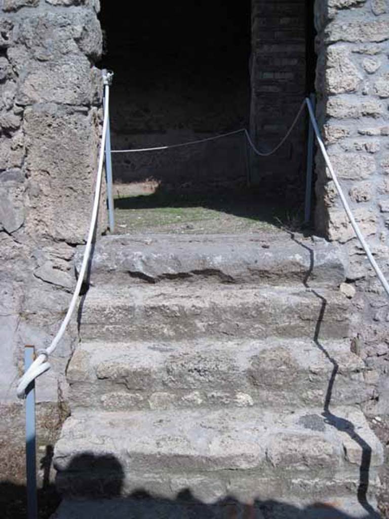 I.5.2 Pompeii. September 2010. Steps leading east towards a back room with fifteen round vats. Photo courtesy of Drew Baker.