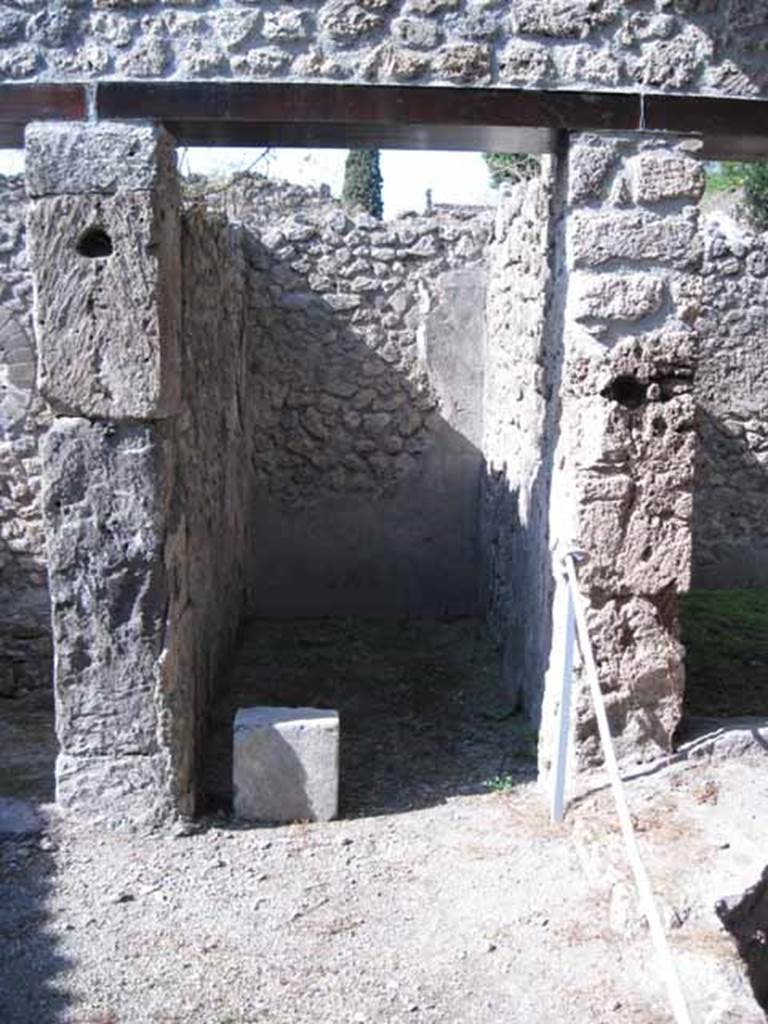 I.5.2 Pompeii. September 2010. Doorway in centre of north wall of industrial room.  Note large square block of cipollino marble.  The doorway on the right, leads to a room possibly used as a dormitory.  Photo courtesy of Drew Baker.