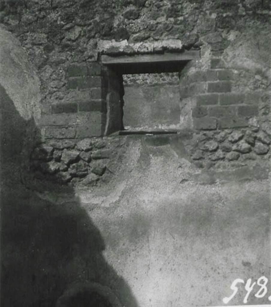 I.5.2 Pompeii. 1936, taken by Tatiana Warscher. 
Looking towards east wall with window overlooking the Vicolo del Citarista, in room in north-east corner of industrial area.
Warscher described this window as being from room “S”, the last (window) in photo no.21) (- l’ultima (finestra) sulla fotografia no.21) 
See Warscher T., 1936. Codex Topographicus Pompeianus: Regio I.1, I.5. (no.22b), Rome: DAIR, whose copyright it remains.