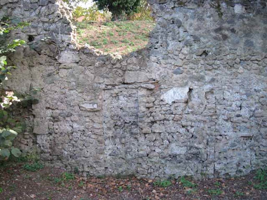 I.5.2 Pompeii. September 2010. South wall. Detail of blocked up doorway (left side of wall) leading to unnamed vicolo running between I.V and city walls, looking south towards wall.  Photo courtesy of Drew Baker.