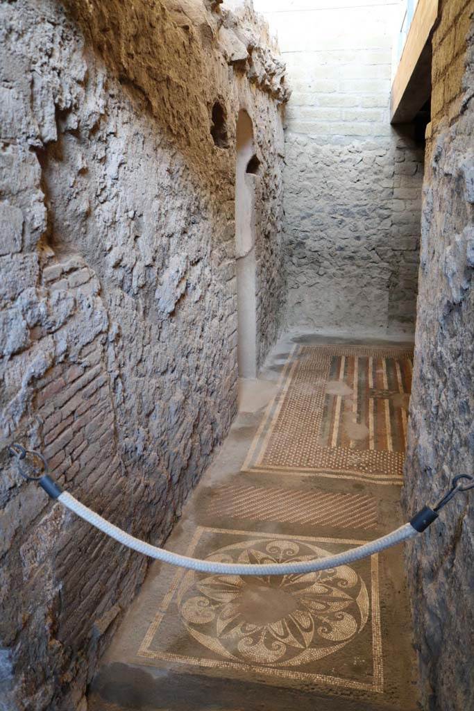 I.6.2 Pompeii. December 2018. 
Looking east across mosaic floors towards arched doorway to frigidarium. Photo courtesy of Aude Durand.